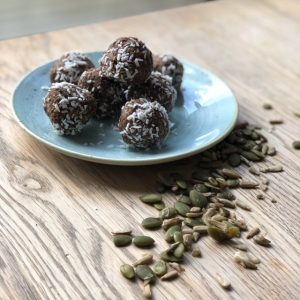 energy balls with sprinkle of seeds on a plate